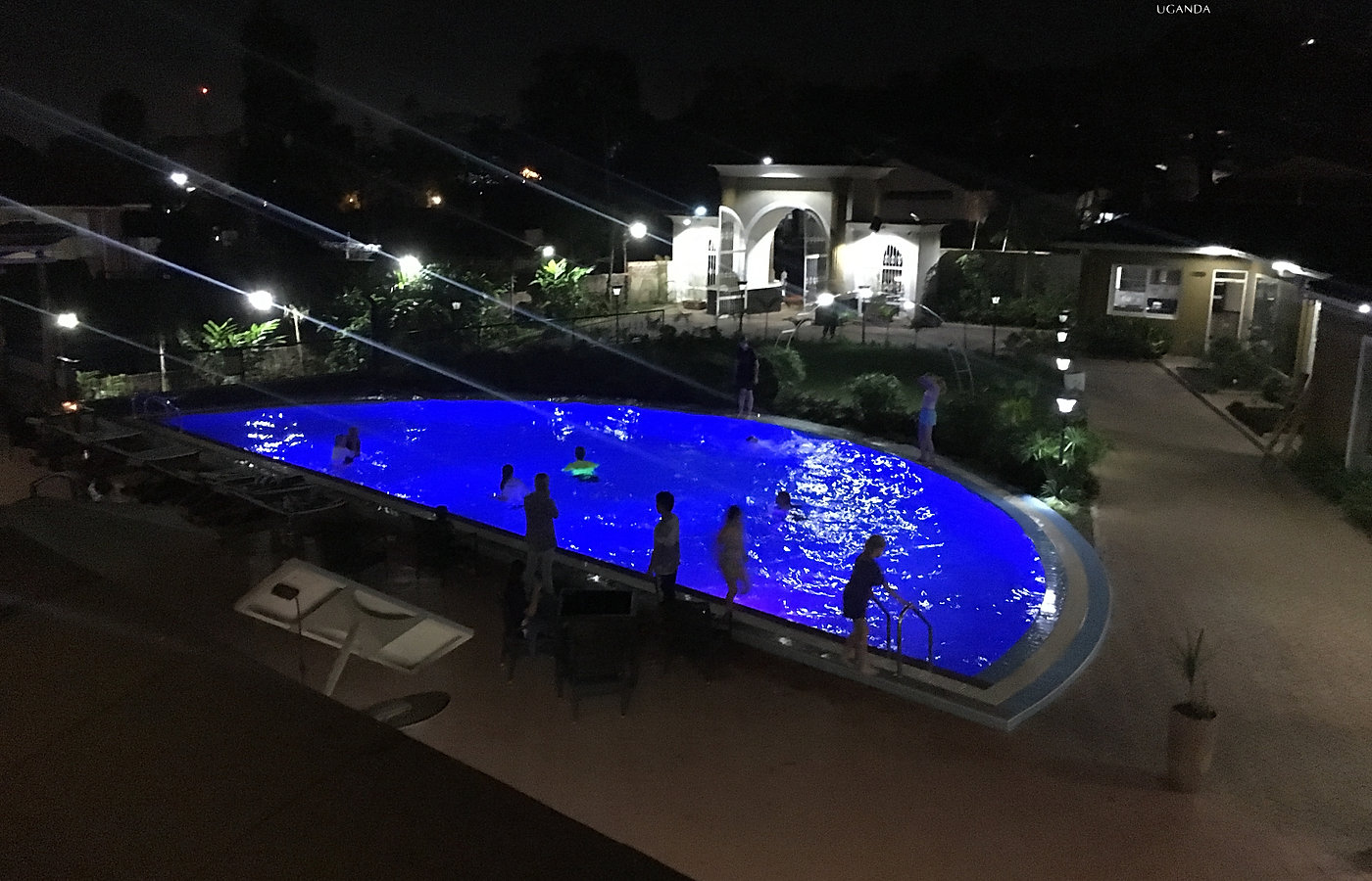Hotel DUOMO pool illuminated for an evening gathering